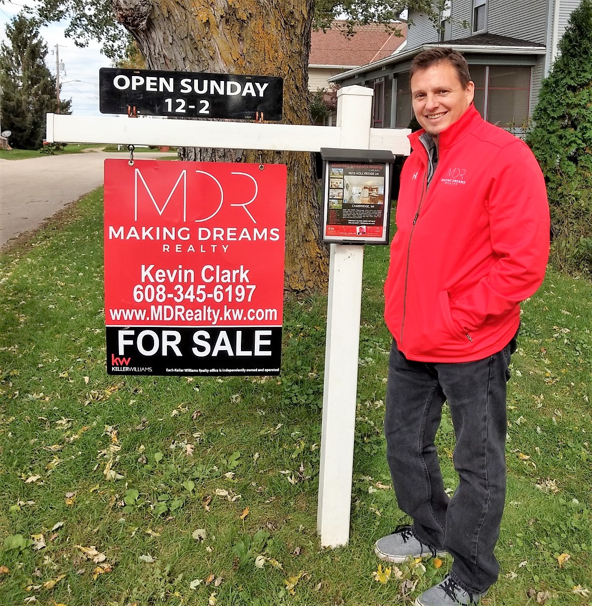 Kevin Clark with For Sale Sign